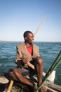 African man stearing a boat near Tofo Royalty Free Stock Photo